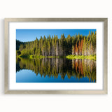 Textured abstract art print of Lake Tahoe in muted blue and silver tones on a framed canvas, suitable for bedroom decor.