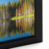 Black wall art featuring a textured depiction of Lake Tahoe with colorful accents, framed canvas.