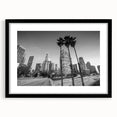 Abstract art print of Los Angeles with vibrant, colorful textures on a large framed canvas, suitable for living room decor.