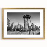 Extra large abstract art print of Los Angeles skyline in muted gold and blue tones on a framed canvas.