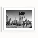 Abstract art print of Los Angeles skyline in muted blue and gray tones on a framed white mat.