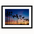 Abstract art print depicting a colorful, textured scenery of Santa Barbara, framed in black, suitable for living room decor.