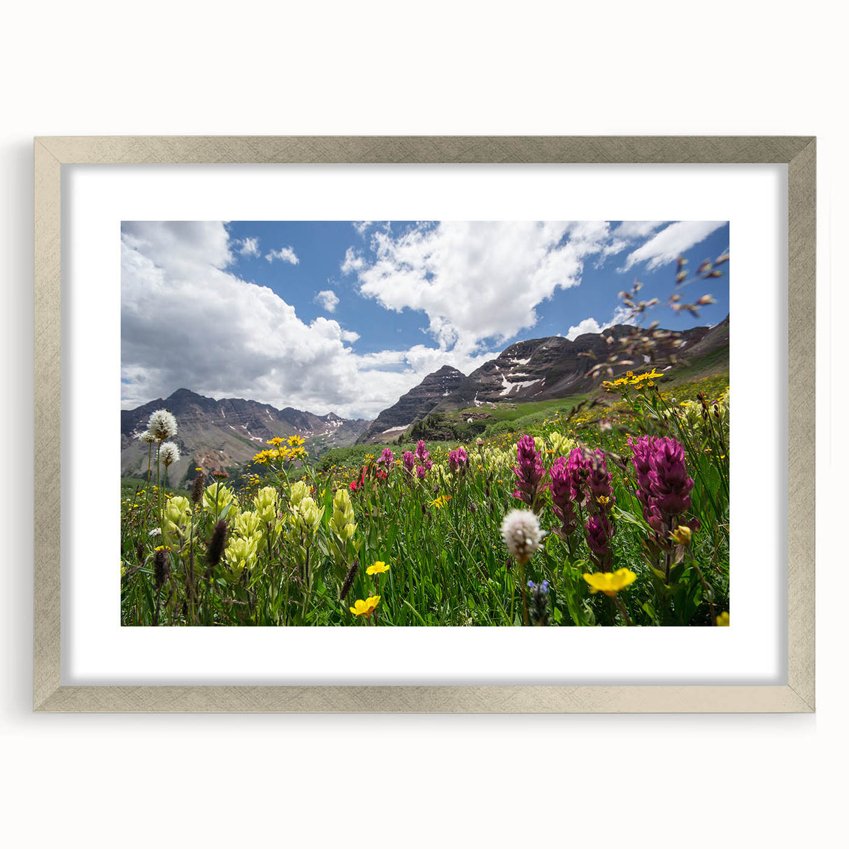 Textured abstract art print of Aspen, Colorado, in muted earth tones on a framed silver mat, suitable for bedroom decor.