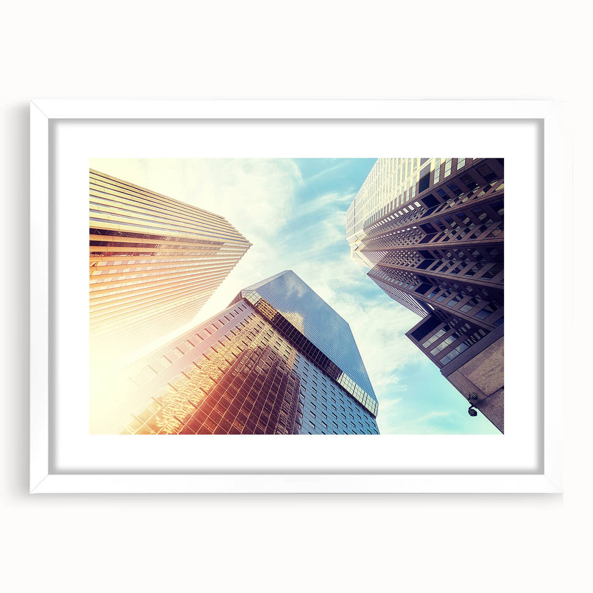 Abstract art print of Denver skyline in muted gray and blue tones on a framed white mat, ideal for dining room decor.