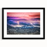 Colorful abstract art print of Pikes Peak with textured brush strokes in a large black frame, ideal for living room decor.