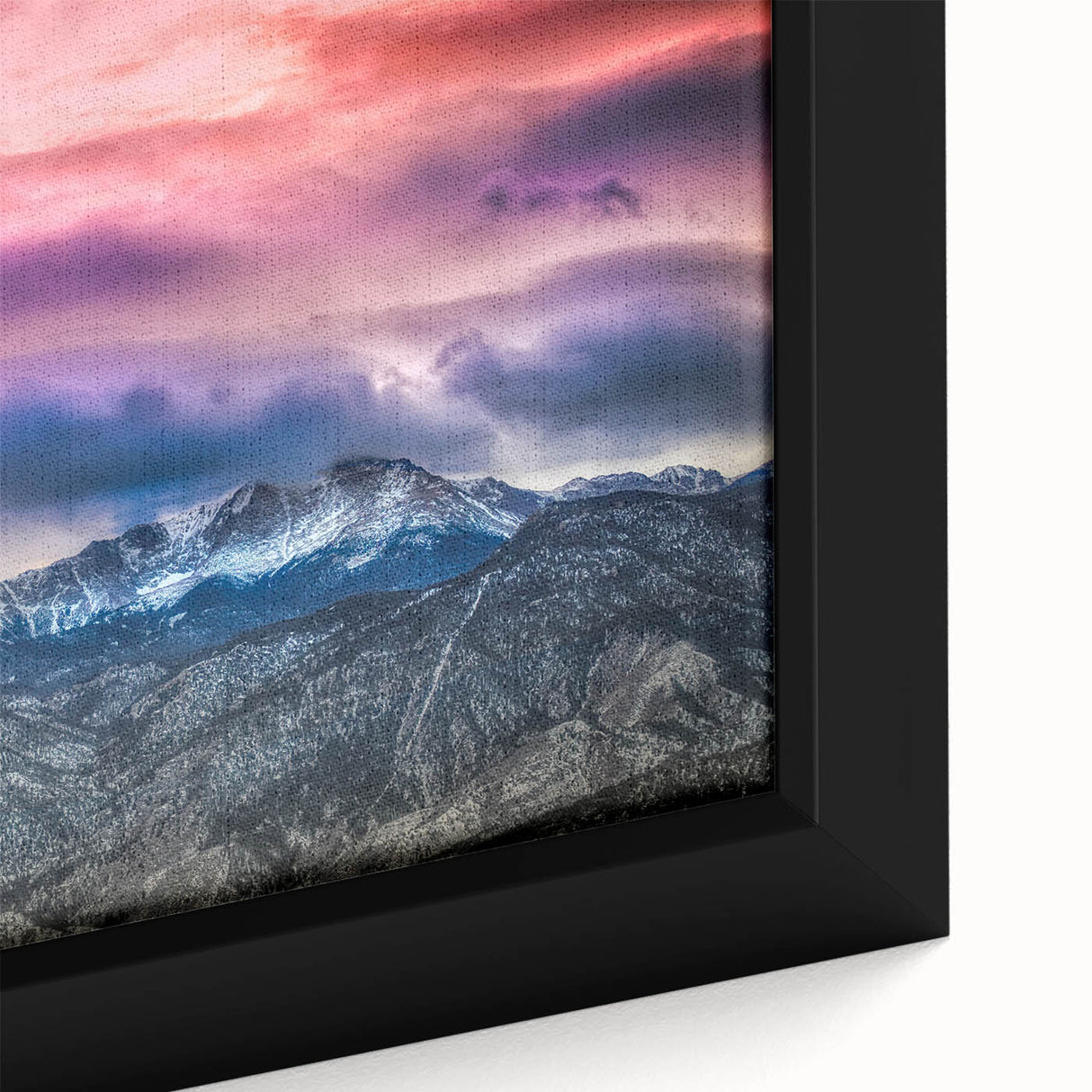Black wall art featuring a textured depiction of Colorado's Pikes Peak in vibrant colors on a framed canvas.