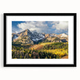 Abstract art print of the Rocky Mountains in vibrant colors on a large textured canvas, framed in black.
