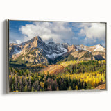 Landscape art painting of the Rocky Mountains on a framed canvas, featuring vibrant green and blue tones.