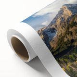 Art deco style poster of the Rocky Mountains in muted earth tones on rolled canvas, ideal for nursery wall art.