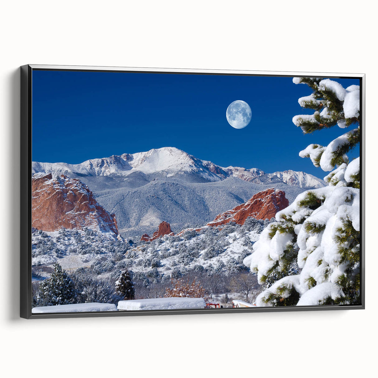 Black and white framed canvas featuring a vintage landscape painting of Colorado Springs, ideal for bedroom decor.