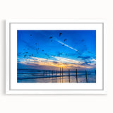 Abstract art print on framed canvas depicting soft, muted blue and white swirls, ideal for dining room decor.