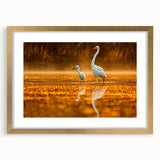 Extra large abstract art print of the Everglades in textured greens and blues, framed in gold, ideal for living room decor.