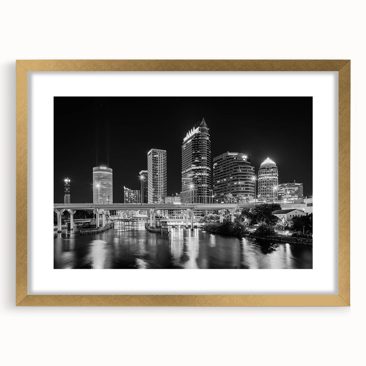 Extra large abstract art print depicting the Tampa skyline in textured gold and blue tones, framed with a gold mat.