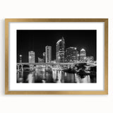 Extra large abstract art print depicting the Tampa skyline in textured gold and blue tones, framed with a gold mat.