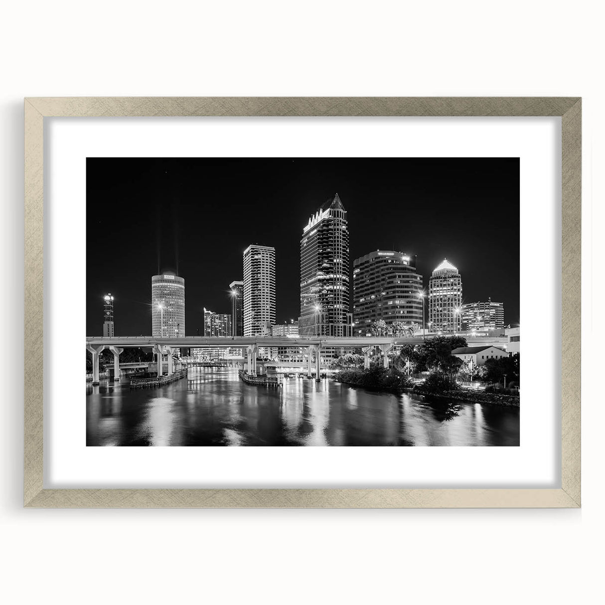 Textured abstract art print of Tampa scenery in muted blues and grays on a framed silver mat, suitable for bedroom decor.