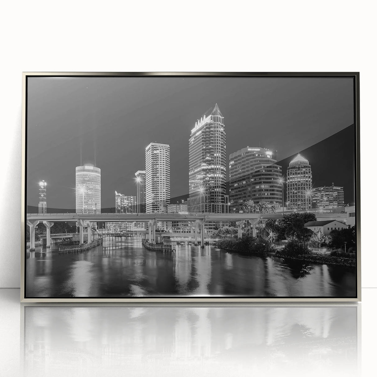 Mid-century modernist art depicting the Tampa skyline in muted blue and silver tones on a framed acrylic print.