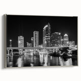 Framed canvas of Tampa landscape with silver frame, featuring colorful art in a vintage poster style.