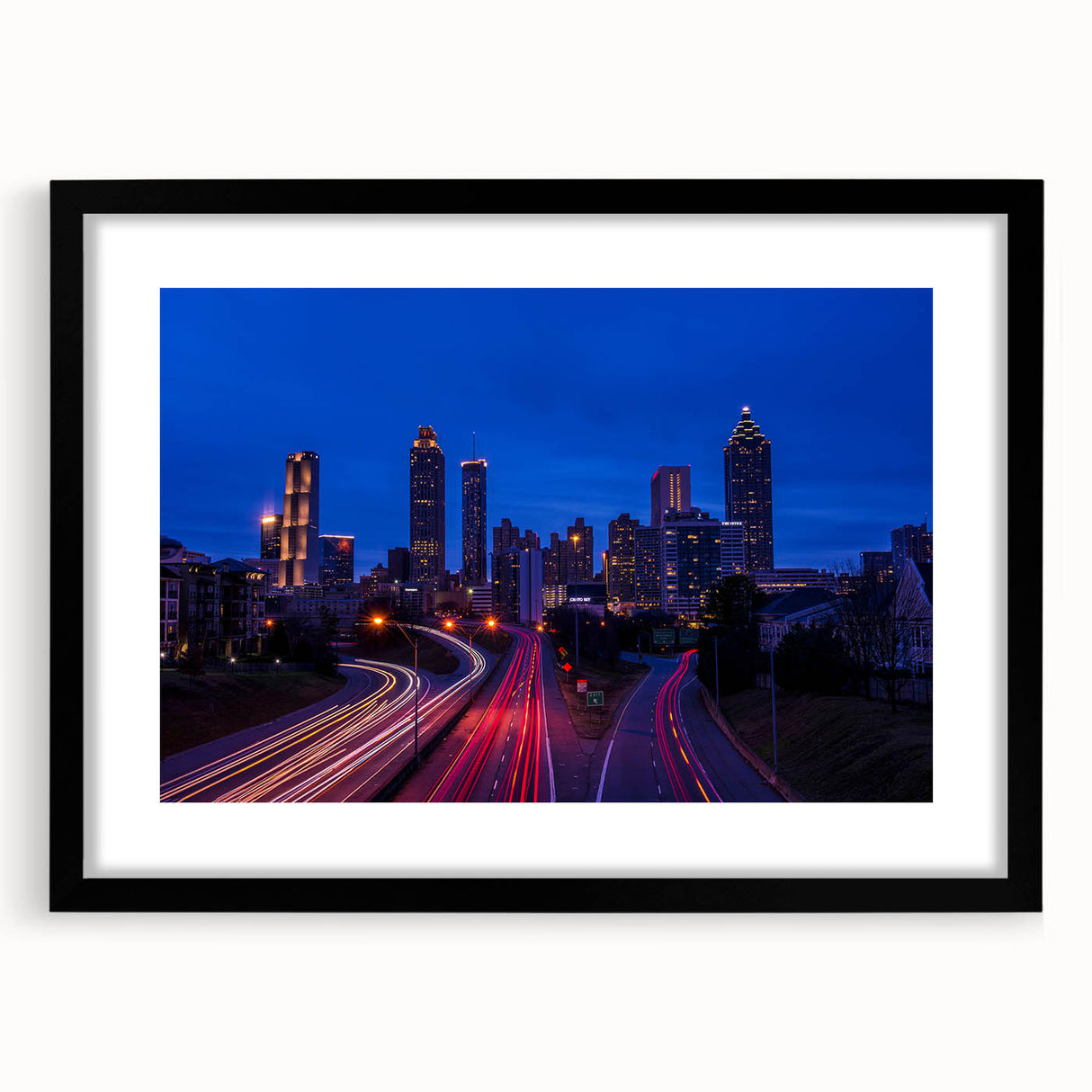 Abstract art print of Atlanta skyline in vibrant colors on a large textured canvas, ideal for living room decor.