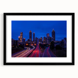 Abstract art print of Atlanta skyline in vibrant colors on a large textured canvas, ideal for living room decor.