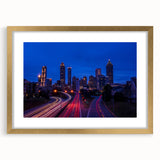 Extra large abstract art print of Atlanta skyline in muted gray and blue tones on a framed canvas.