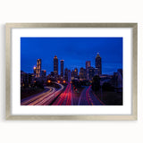 Textured abstract art print of the Atlanta skyline in muted gray tones on framed canvas, suitable for bedroom decor.