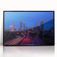 Large abstract wall art of Atlanta skyline in muted gray and blue tones on framed acrylic.