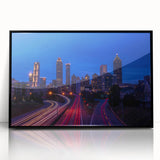 Large abstract wall art of Atlanta skyline in muted gray and blue tones on framed acrylic.