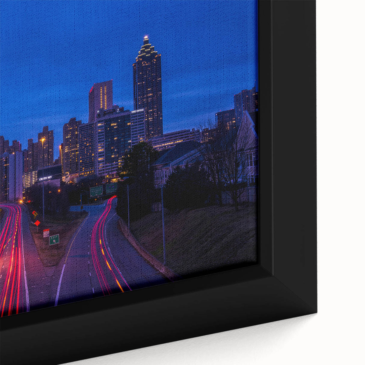 Framed canvas of the Atlanta skyline in textured black with colorful highlights, ideal for large living room walls.
