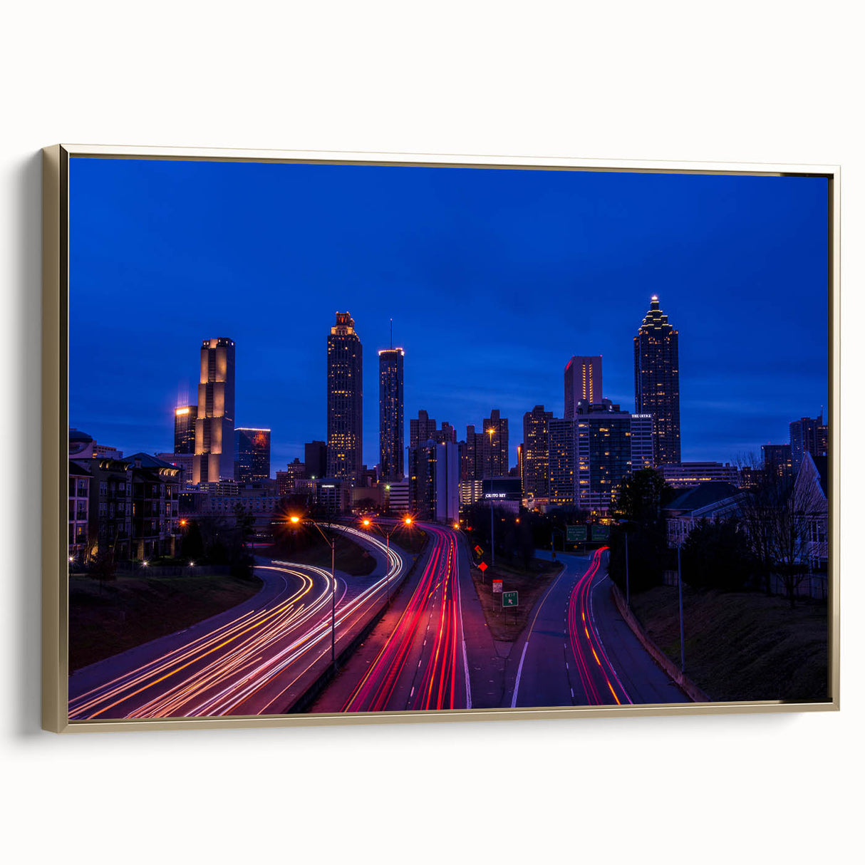 Framed canvas of Atlanta skyline in muted gold and black tones, suitable as wall art for a bedroom.