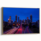 Framed canvas of Atlanta skyline in muted gold and black tones, suitable as wall art for a bedroom.