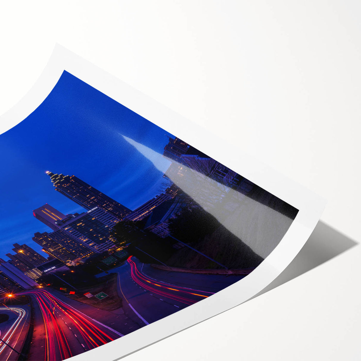 Extra large wall art featuring line art flowers over a muted Atlanta skyline on rolled canvas.