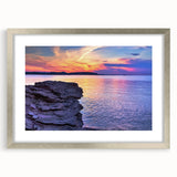 Textured abstract art print of Lake Michigan, using muted blue tones on a framed silver mat, ideal for bedroom art.