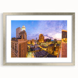 Textured abstract art print of New Orleans scenery in muted earth tones on a framed canvas, suitable for bedroom decor.