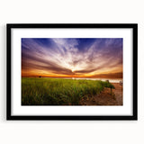 Extra large abstract art print of a colorful Maine landscape in vibrant hues on a textured canvas, framed in black.