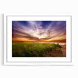 Abstract art print of a serene Maine landscape in muted blue and green tones on a framed white mat.