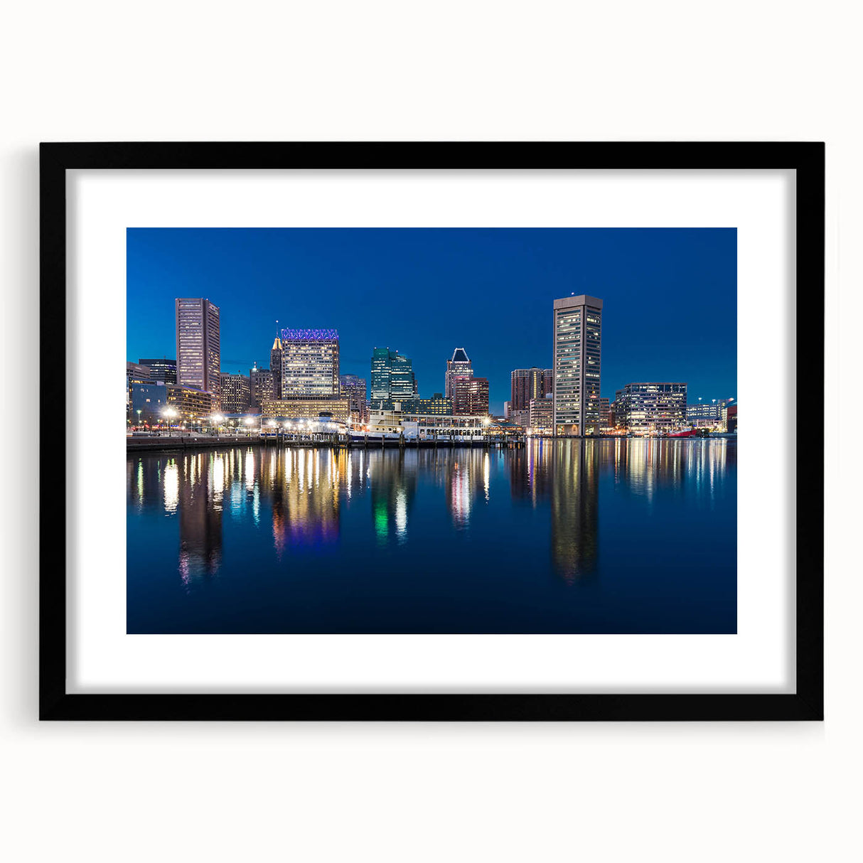 Extra large abstract art print of Baltimore skyline in vibrant colors on a textured canvas, framed in black.