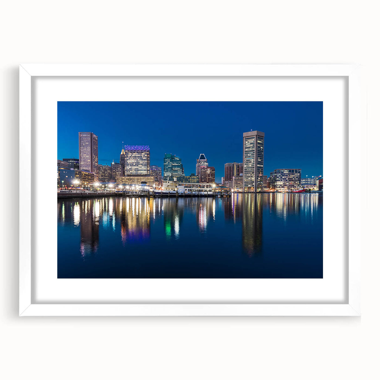 Abstract art print of Baltimore skyline in muted blue and gray tones on a framed white canvas, ideal for dining room decor.