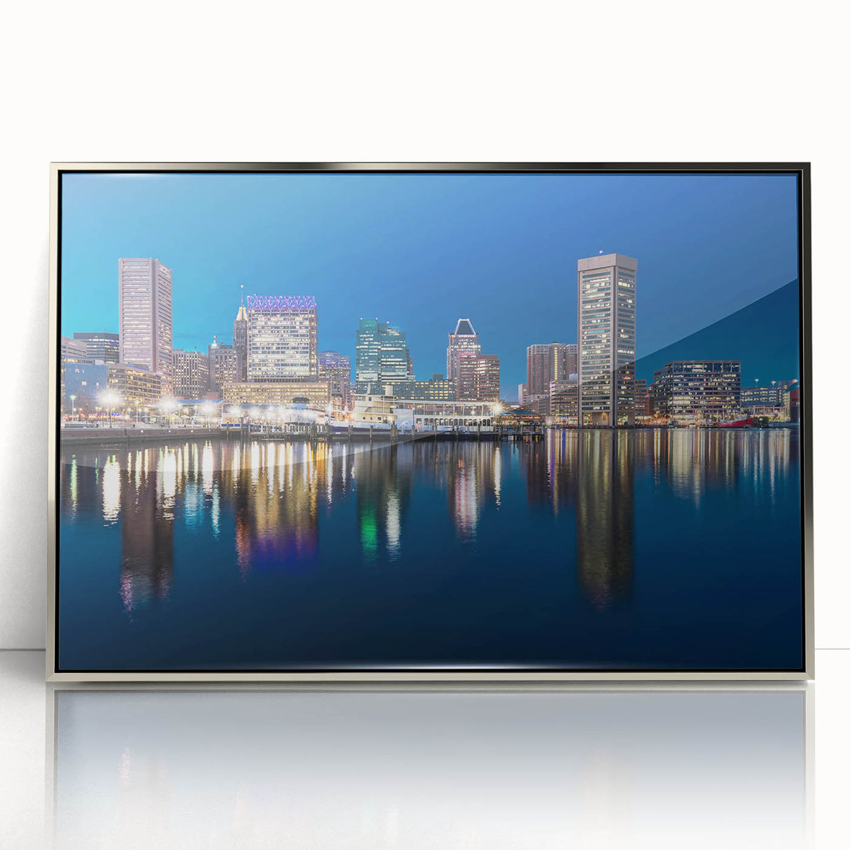 Mid-century modernist art depicting the Baltimore skyline in muted gray and blue tones, framed in silver acrylic.