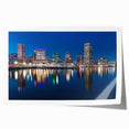 Rolled print of Baltimore scenery with floral accents in soft blue and green tones.