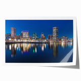 Rolled print of Baltimore scenery with floral accents in soft blue and green tones.