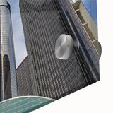 Large abstract wall art depicting the Detroit skyline in muted gray and blue tones on acrylic glass.