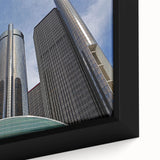 Framed canvas depicting a textured, colorful Detroit skyline on a black background, ideal for living room decor.