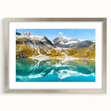 Textured abstract art print of Glacier National Park in muted earth tones, framed with a silver mat, ideal for bedroom art.