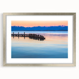 Textured abstract art print of Montana scenery in muted earth tones, framed in silver, ideal for bedroom art.