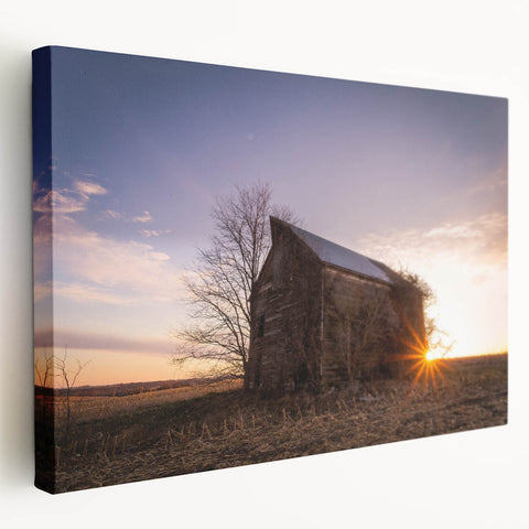 Side view of a large stretched canvas depicting a serene Nebraska landscape in soft earth tones.