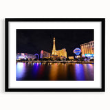 Extra large abstract art print of colorful Las Vegas skyline on textured canvas, framed in black.