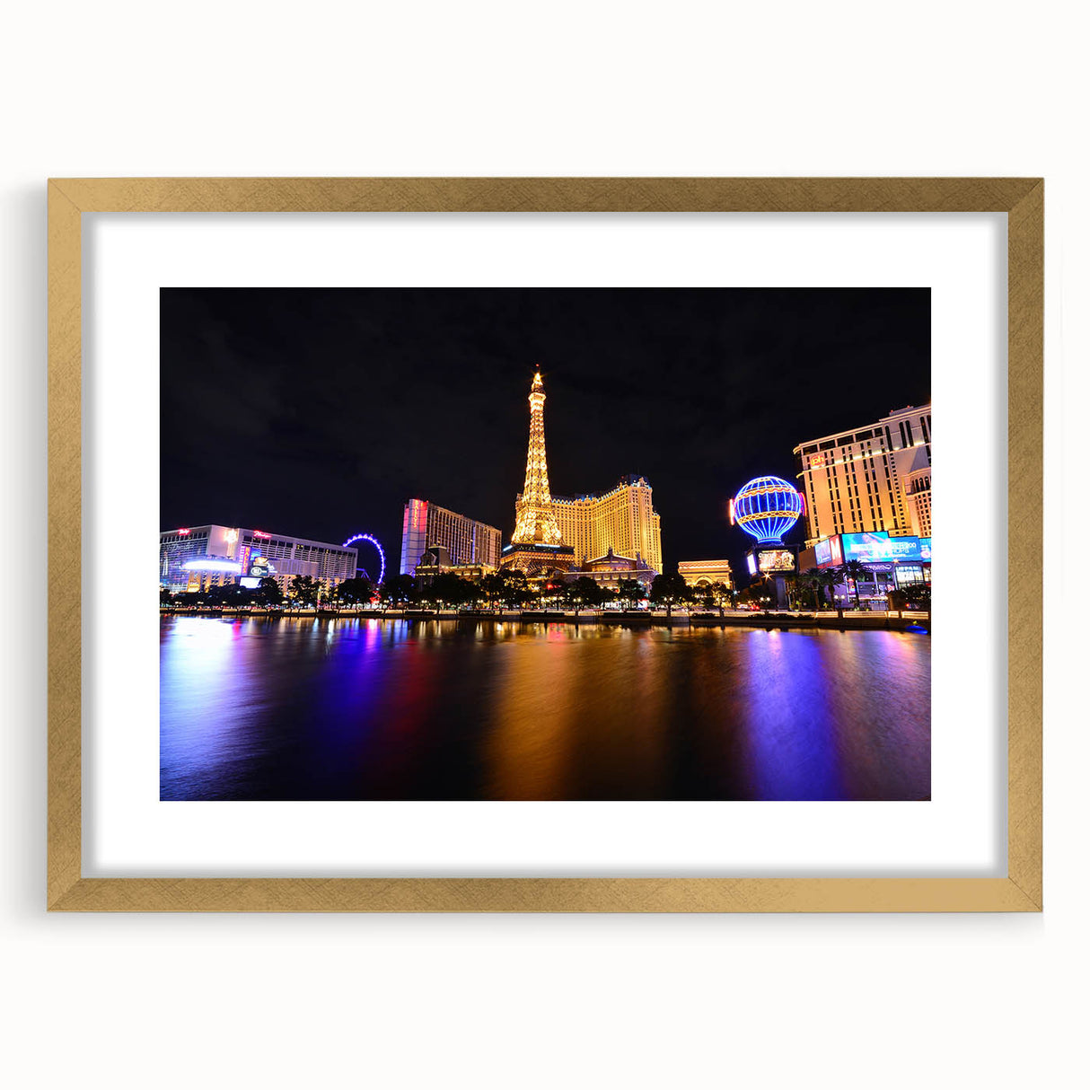 Extra large abstract art print featuring textured Las Vegas skyline, in muted gold and blue tones on framed canvas.