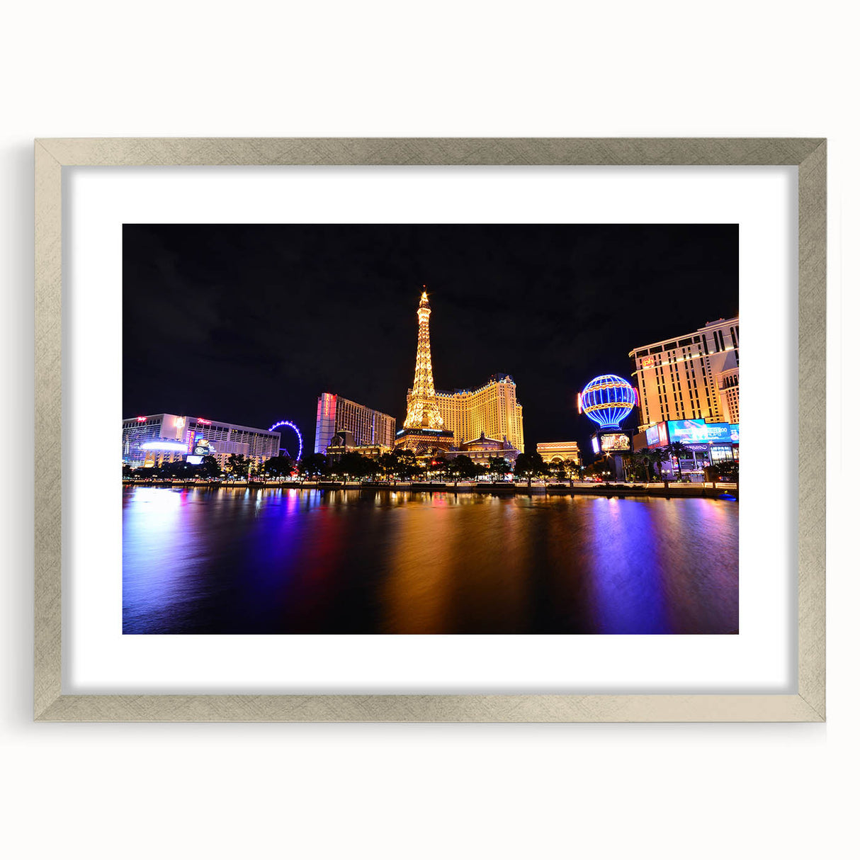 Textured art of abstract Las Vegas skyline in muted gray tones on a framed silver mat, ideal for modern bedroom ambiance.