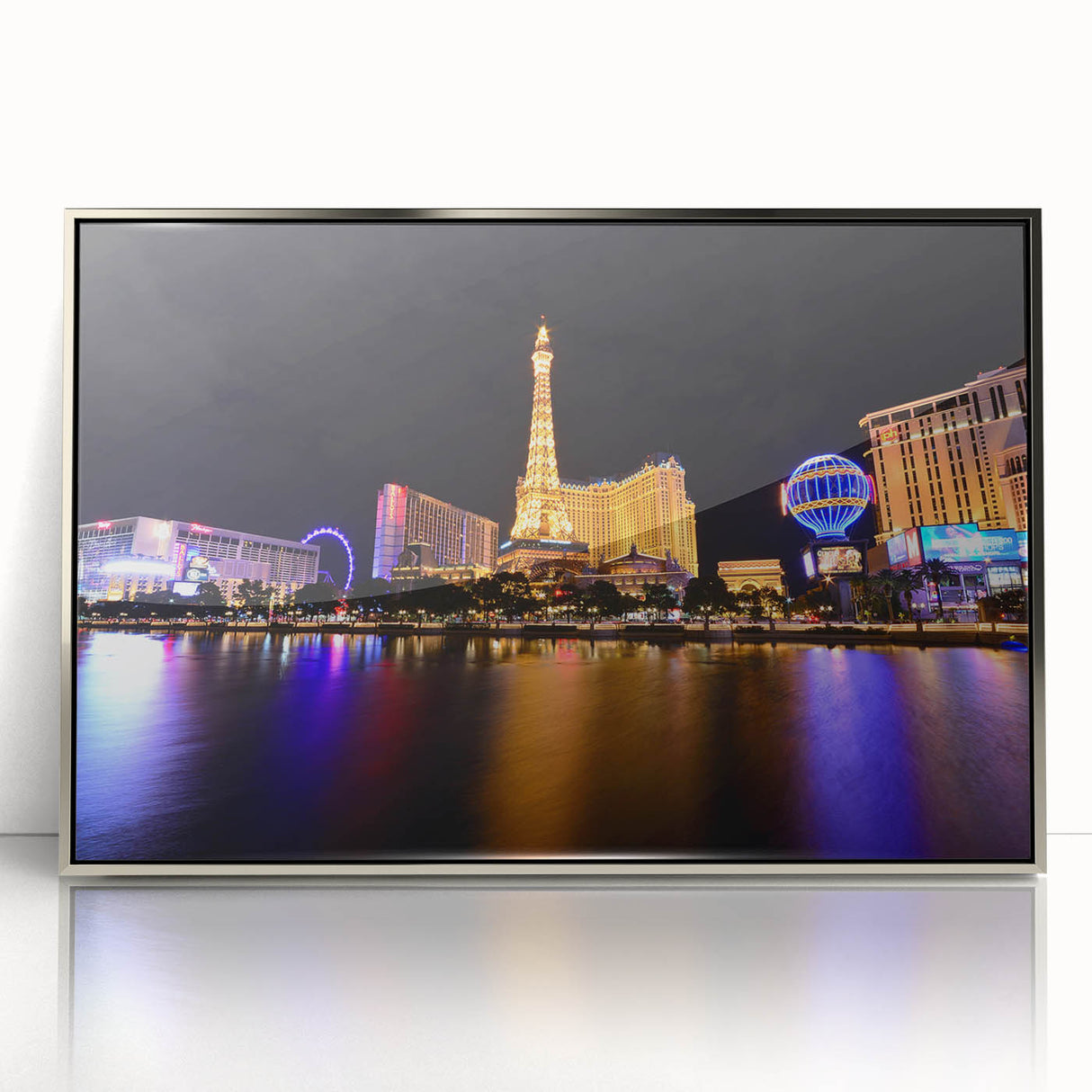 Mid-century modernist art of Las Vegas skyline in muted metallic tones on a framed acrylic print.