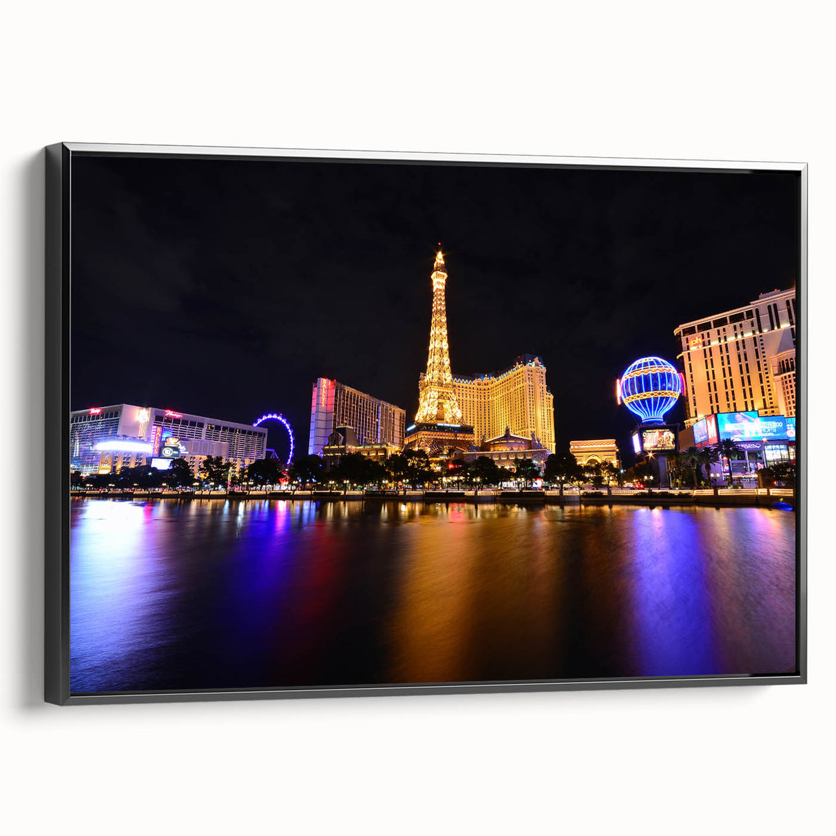 Black and white framed canvas of the Las Vegas skyline, ideal for bedroom wall decor.